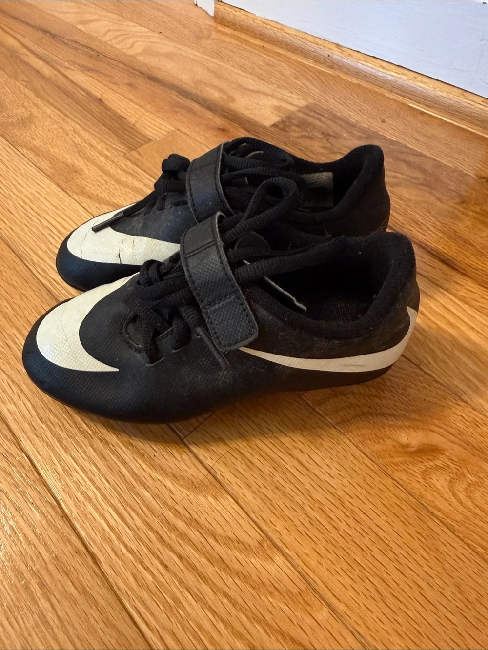 Nike Kids Black Soccer Cleats with White Swoosh